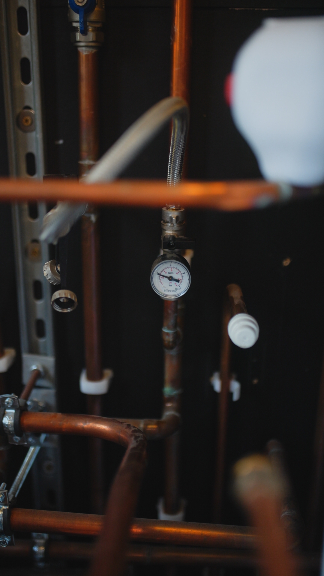 Plumbing on demand job photo looking at pipes and a valve