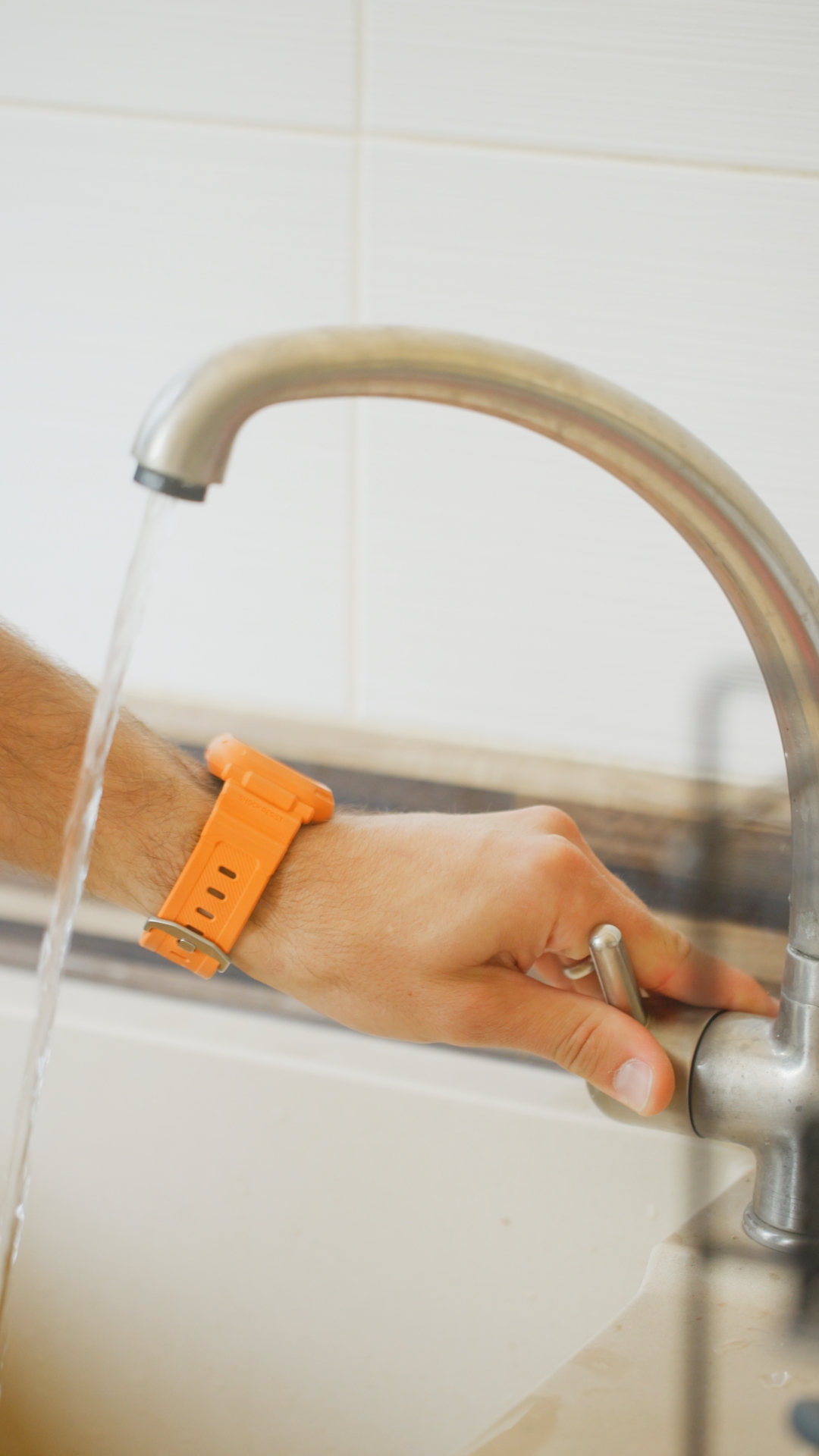 Plumbing on demand close up of hand fixing a tap